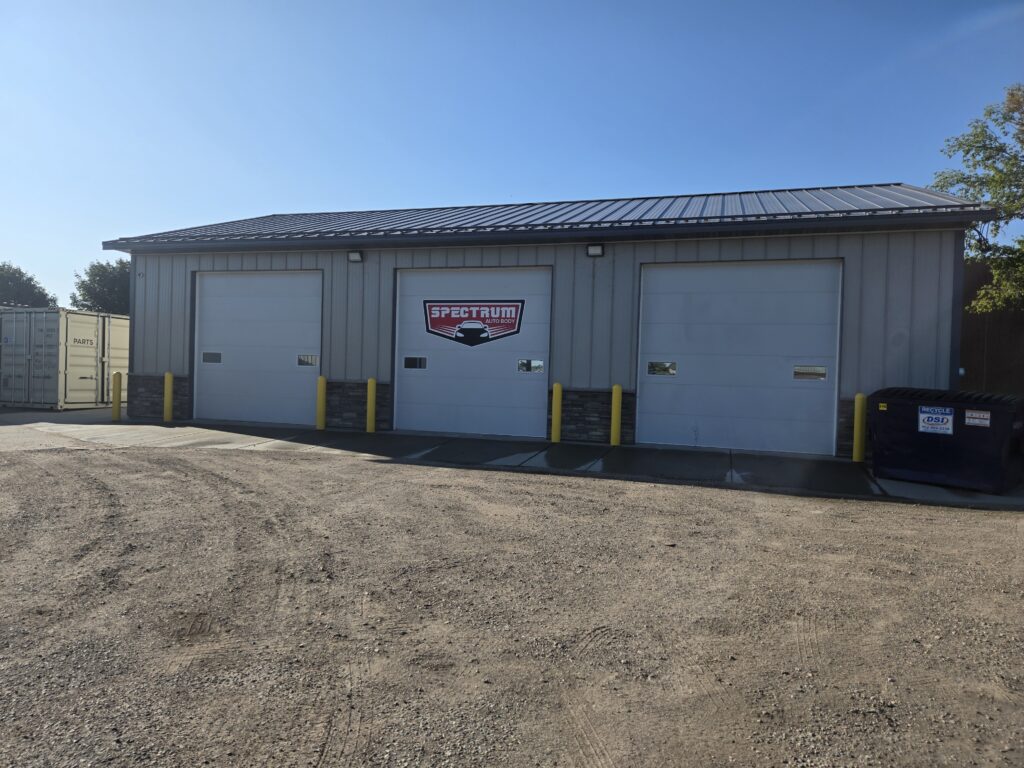 Spectrum Auto Body collision repair shop bay doors in Belle Plaine, Minnesota