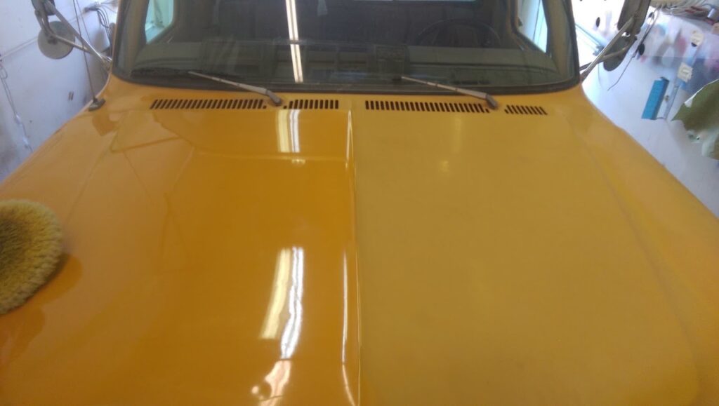Freshly refinished yellow hood after paint repair at Spectrum Auto Body